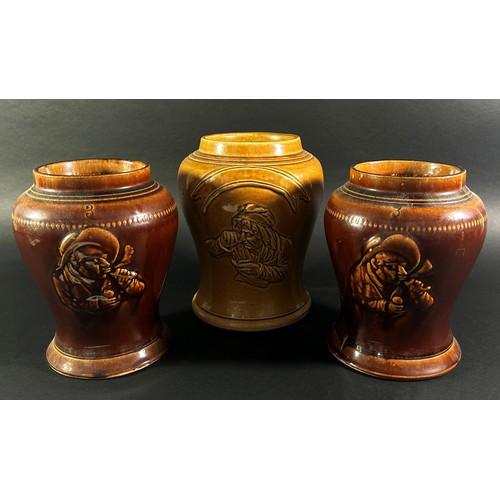 102 - A collection of three salt glazed snuff jars with character detail