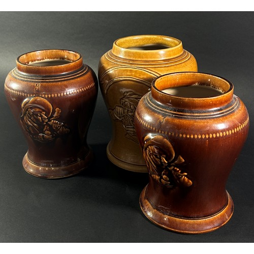 102 - A collection of three salt glazed snuff jars with character detail