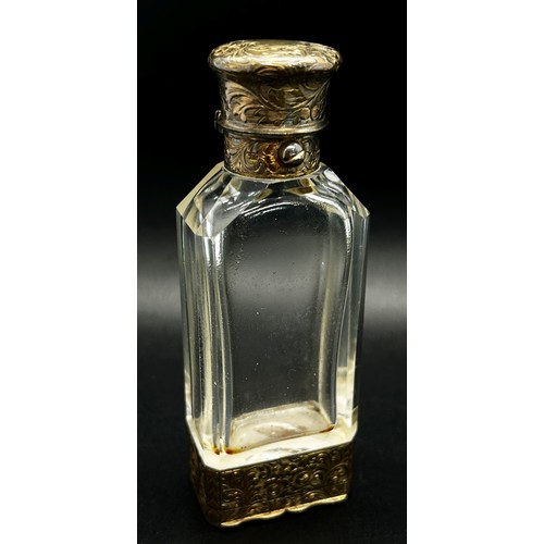 386 - An unusual glass and silver scent bottle incorporating a vinaigrette by S. Mordan, with silver gilt ... 