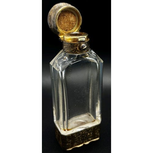 386 - An unusual glass and silver scent bottle incorporating a vinaigrette by S. Mordan, with silver gilt ... 