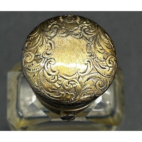 386 - An unusual glass and silver scent bottle incorporating a vinaigrette by S. Mordan, with silver gilt ... 