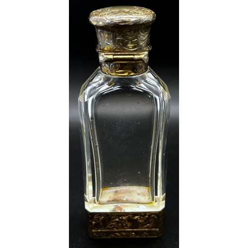 386 - An unusual glass and silver scent bottle incorporating a vinaigrette by S. Mordan, with silver gilt ... 