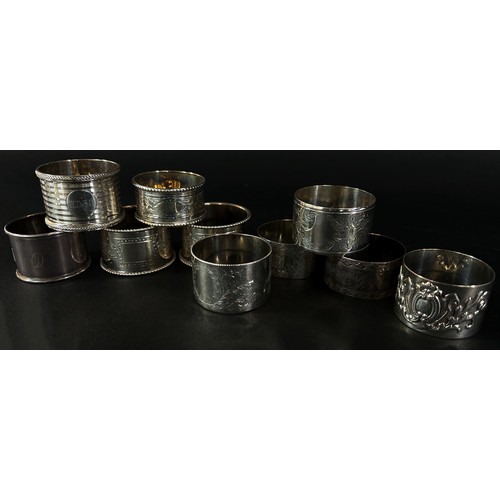 245 - A selection of ten silver napkin rings, some matching, 9 ozs approximately