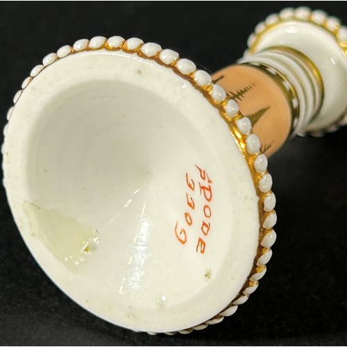 408 - A miniature Spode taper stick with beaded borders on a pale salmon ground, overlaid with gold detail... 