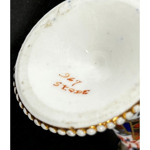 409 - An early 19th century miniature Spode taper stick with beaded rims, richly decorated with Imari deta... 