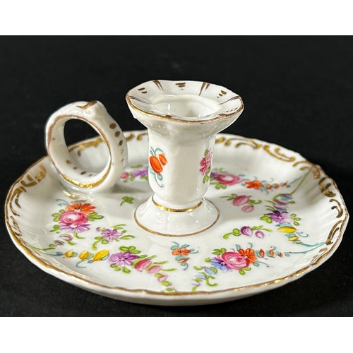 412 - A miniature Dresden chamberstick with hand painted floral swag detail, with loop handle, 3.5cm high