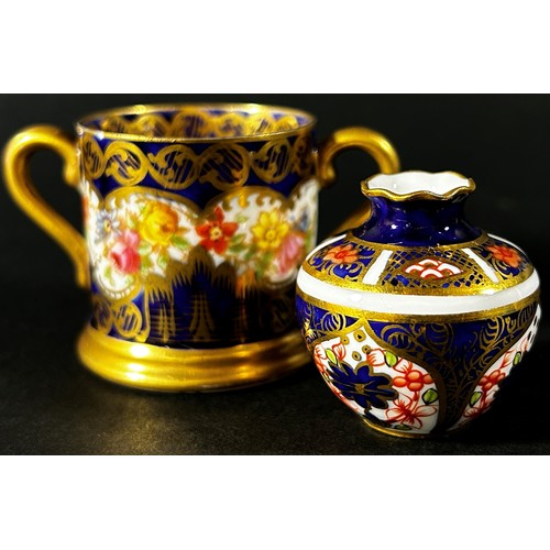 415 - Crown Derby miniature cup and saucer with rich Imari detail, further miniature vase similarly decora... 