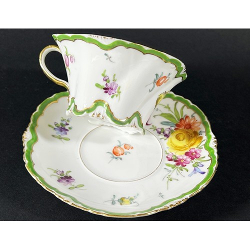 419 - A Dresden cabinet cup and saucer with hand painted floral sprays within green and gilt bands