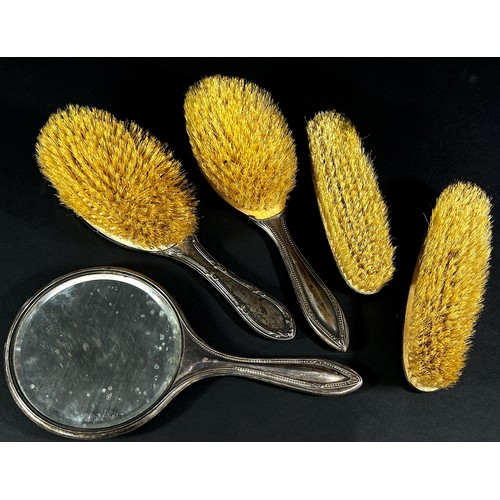 219A - Four silver backed brushes and a single silver backed hand mirror (5)