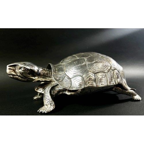 219 - A silver inkwell in the form of a life size tortoise, the shell hinged opening to reveal a glass ink... 