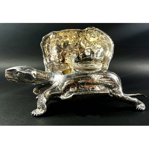 219 - A silver inkwell in the form of a life size tortoise, the shell hinged opening to reveal a glass ink... 