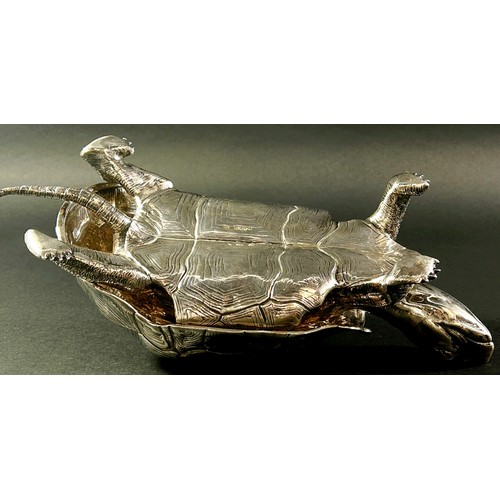 219 - A silver inkwell in the form of a life size tortoise, the shell hinged opening to reveal a glass ink... 