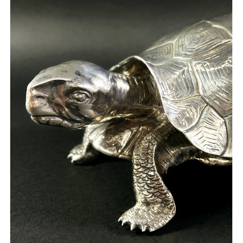 219 - A silver inkwell in the form of a life size tortoise, the shell hinged opening to reveal a glass ink... 