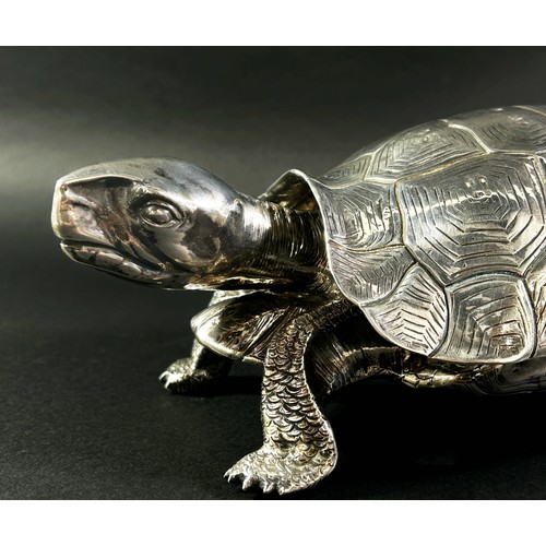 219 - A silver inkwell in the form of a life size tortoise, the shell hinged opening to reveal a glass ink... 