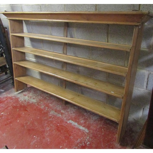 1012 - A stripped pine kitchen open plate rack  with four fixed shelves and chamfered detail, 133 cm high x... 