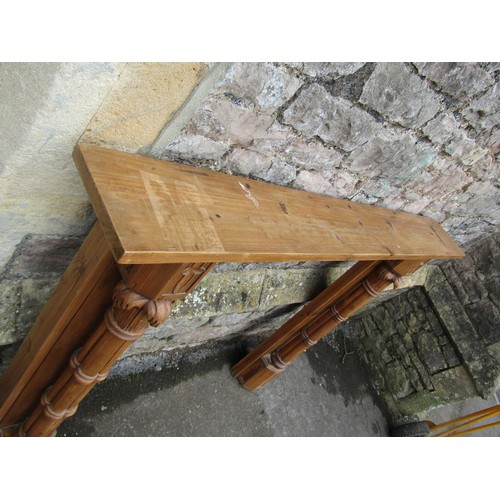 1027 - A contemporary stripped pine Gothic style fire surround labelled verso 111 cm high, the mantle 150 c... 