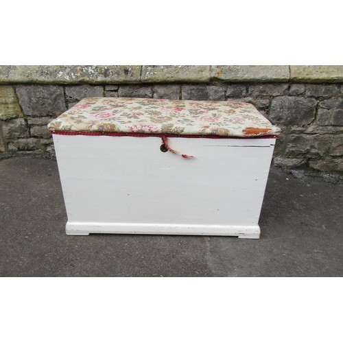 1062 - An old painted pine blanket box with later upholstered lid 48 cm high x 83 cm x 47 cm