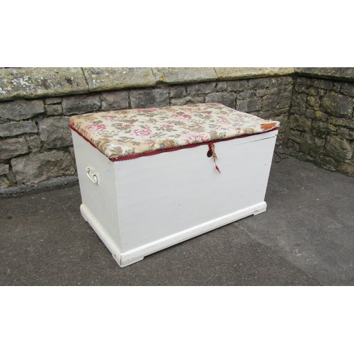 1062 - An old painted pine blanket box with later upholstered lid 48 cm high x 83 cm x 47 cm