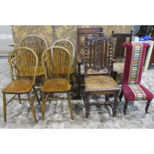 1075 - A set of four (3&1) Windsor stained beechwood wheelback dining chairs together with two rush seated ... 