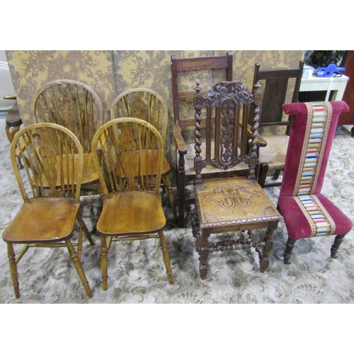 1075 - A set of four (3&1) Windsor stained beechwood wheelback dining chairs together with two rush seated ... 