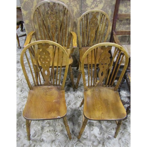 1075 - A set of four (3&1) Windsor stained beechwood wheelback dining chairs together with two rush seated ... 