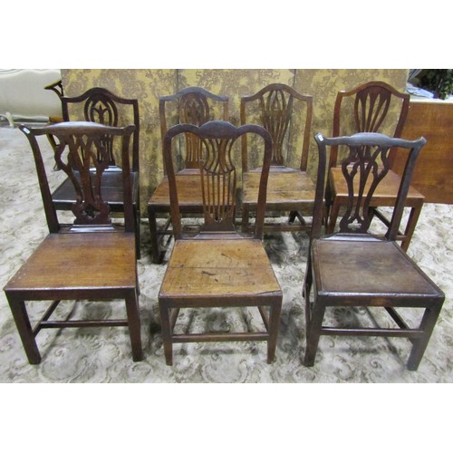 1077 - Nine Georgian oak country made dining chairs of varying design (af)