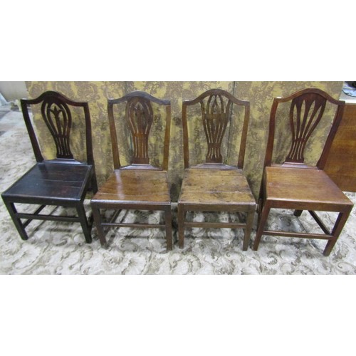 1077 - Nine Georgian oak country made dining chairs of varying design (af)