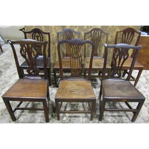 1077 - Nine Georgian oak country made dining chairs of varying design (af)