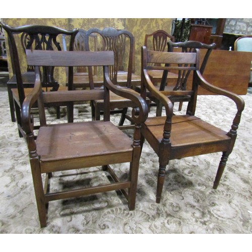 1077 - Nine Georgian oak country made dining chairs of varying design (af)