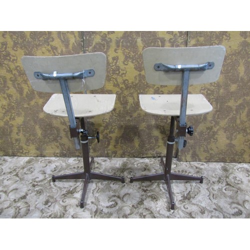 1079 - A pair of vintage swivel machinist/typist chairs with moulded plywood seats and backs