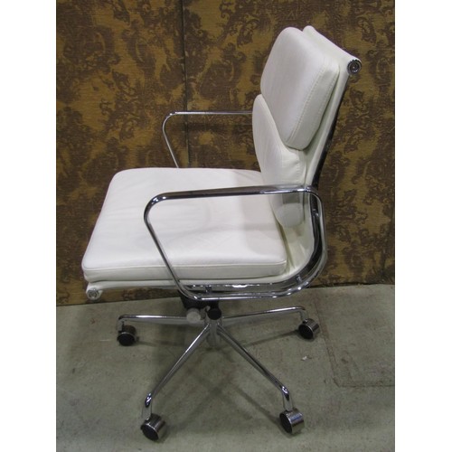 1080 - A contemporary chrome framed office chair with swivel base, upholstered in a faux white leather fini... 