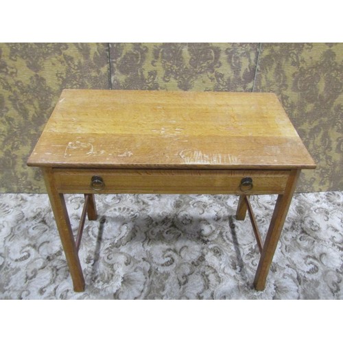 1086 - An Arts & Crafts oak side table with shallow frieze drawer raised on square cut and moulded supports... 