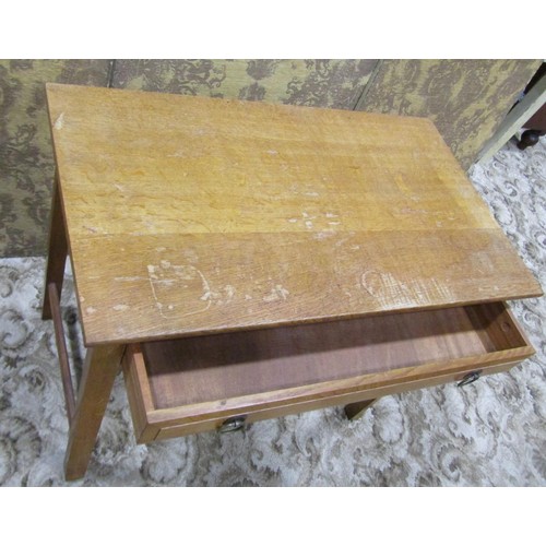 1086 - An Arts & Crafts oak side table with shallow frieze drawer raised on square cut and moulded supports... 