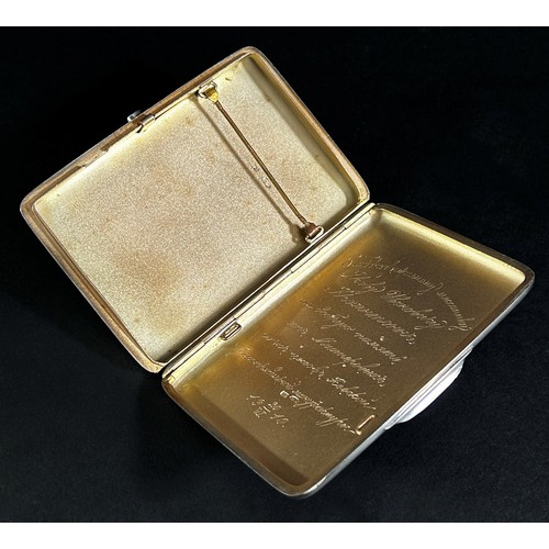 223 - A Russian silver gilt cigarette case hallmarked Moscow 84 with a gilt monogram and Russian inscripti... 