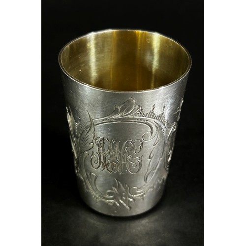 224 - A Russian silver vodka shot beaker hallmarked St Petersburg 84, together with three Russian silver s... 