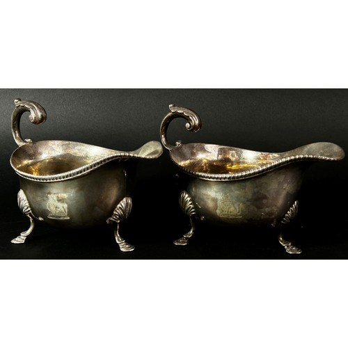 236 - A pair of early 19th century silver gravy boats with acanthus scrolled handle, hallmarks rubbed, 14.... 