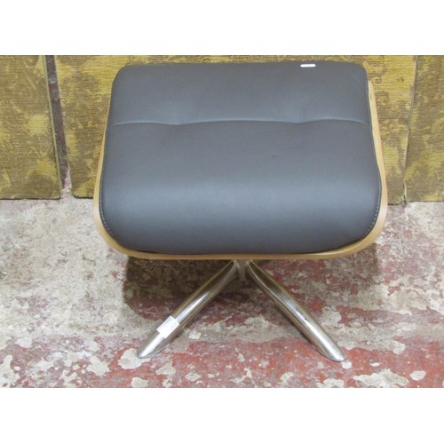 1090 - A contemporary chrome and leather Eames style footstool