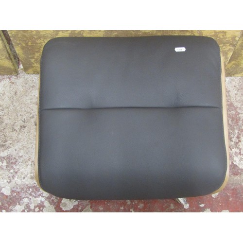 1090 - A contemporary chrome and leather Eames style footstool