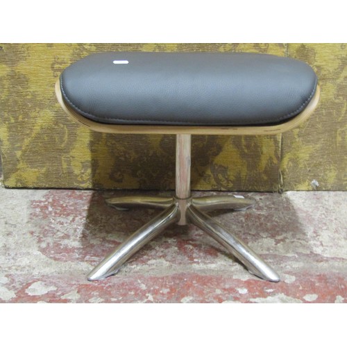 1090 - A contemporary chrome and leather Eames style footstool