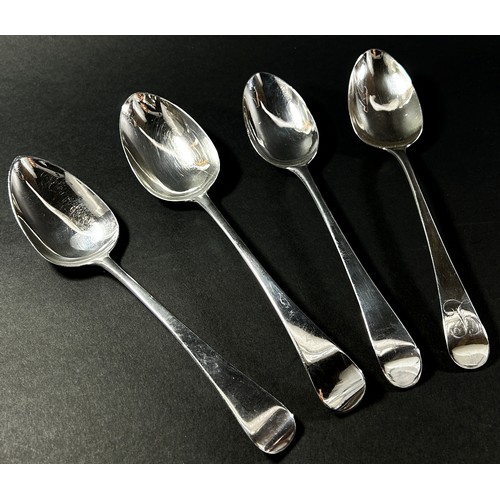 256 - Four Georgian silver serving spoons by various makers, each approximately 23 cm long, 7.1 oz approxi... 