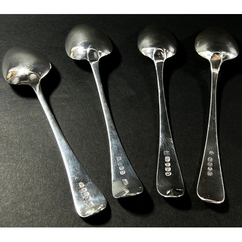 256 - Four Georgian silver serving spoons by various makers, each approximately 23 cm long, 7.1 oz approxi... 