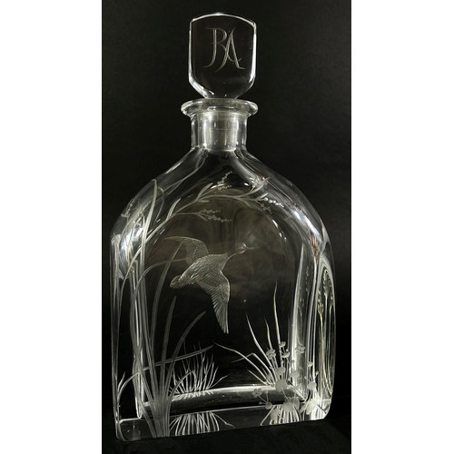 131 - A cut glass Swedish Orrefors decanter with a flying duck amongst river plants, the initials RA engra... 