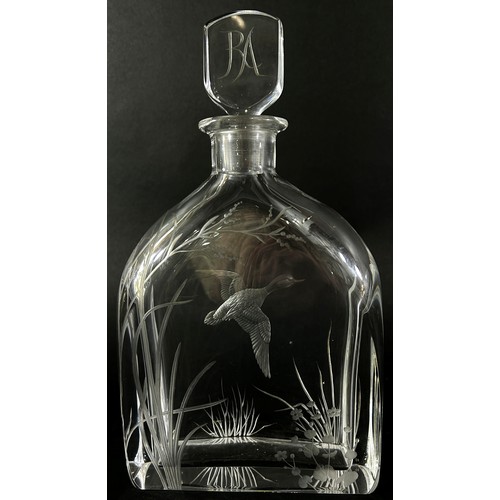 131 - A cut glass Swedish Orrefors decanter with a flying duck amongst river plants, the initials RA engra... 