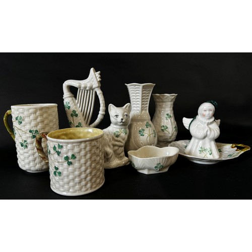 34 - A collection of Belleek mugs, etc (14)