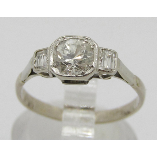 282 - Art Deco 18ct white gold three stone diamond ring, centre stone 0.65ct approx, flanked by a pair of ... 