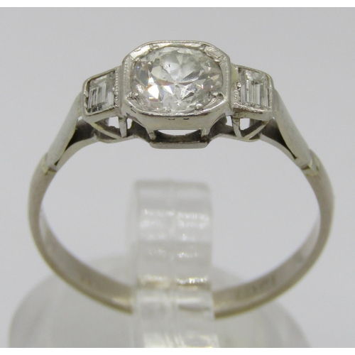 282 - Art Deco 18ct white gold three stone diamond ring, centre stone 0.65ct approx, flanked by a pair of ... 