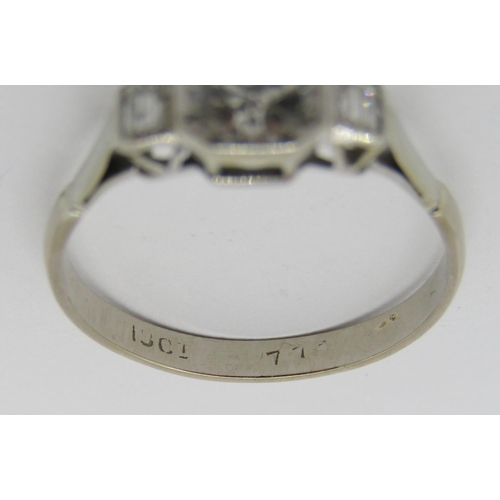 282 - Art Deco 18ct white gold three stone diamond ring, centre stone 0.65ct approx, flanked by a pair of ... 