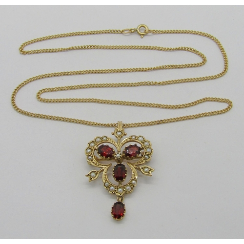 309 - Antique style 9ct trefoil drop pendant / brooch set with garnets and seed pearls, hung from a 9ct fi... 