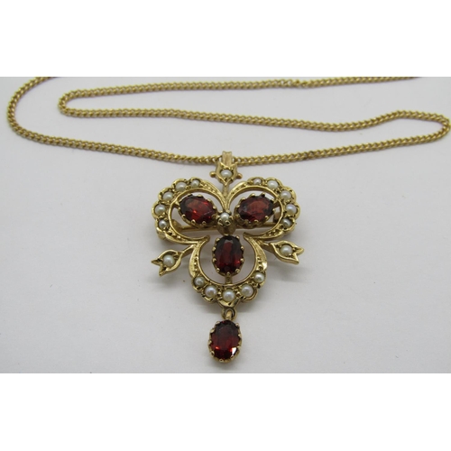 309 - Antique style 9ct trefoil drop pendant / brooch set with garnets and seed pearls, hung from a 9ct fi... 