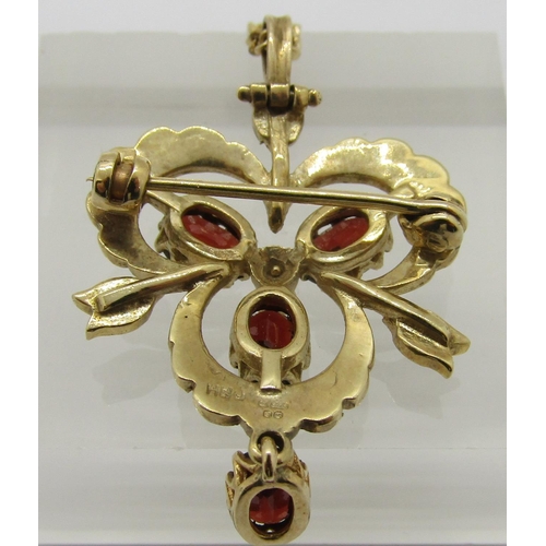 309 - Antique style 9ct trefoil drop pendant / brooch set with garnets and seed pearls, hung from a 9ct fi... 